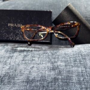 Prada Tortoiseshell Eyeglass Frames - Brown/Amber Pattern